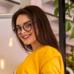 Free Photo Young beautiful woman works in the office and speak video call on laptop